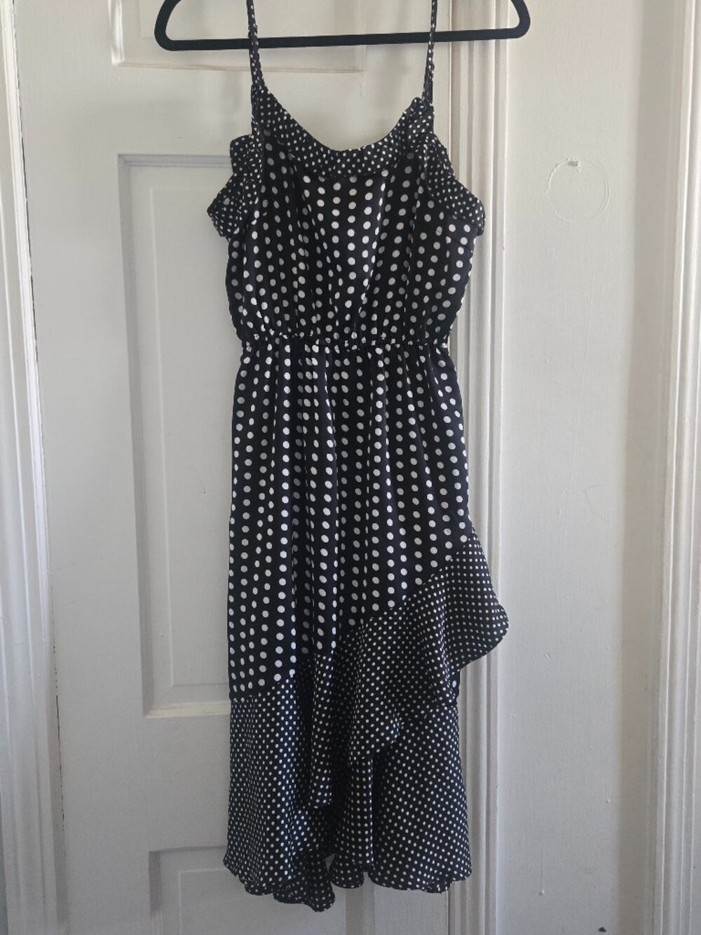 Beulah Black and White Polka Dot sleeveless dress with an asymmetrical ruffle